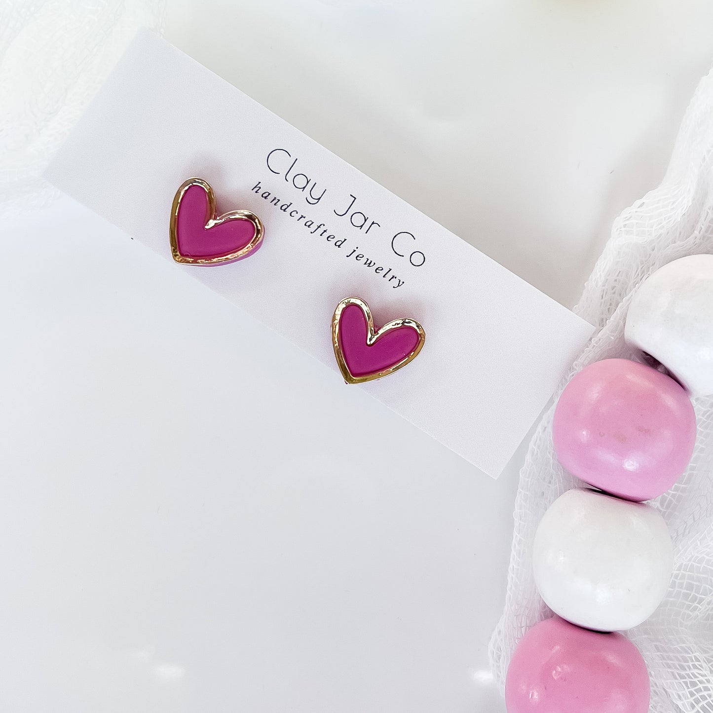 Heart charm stud earrings
