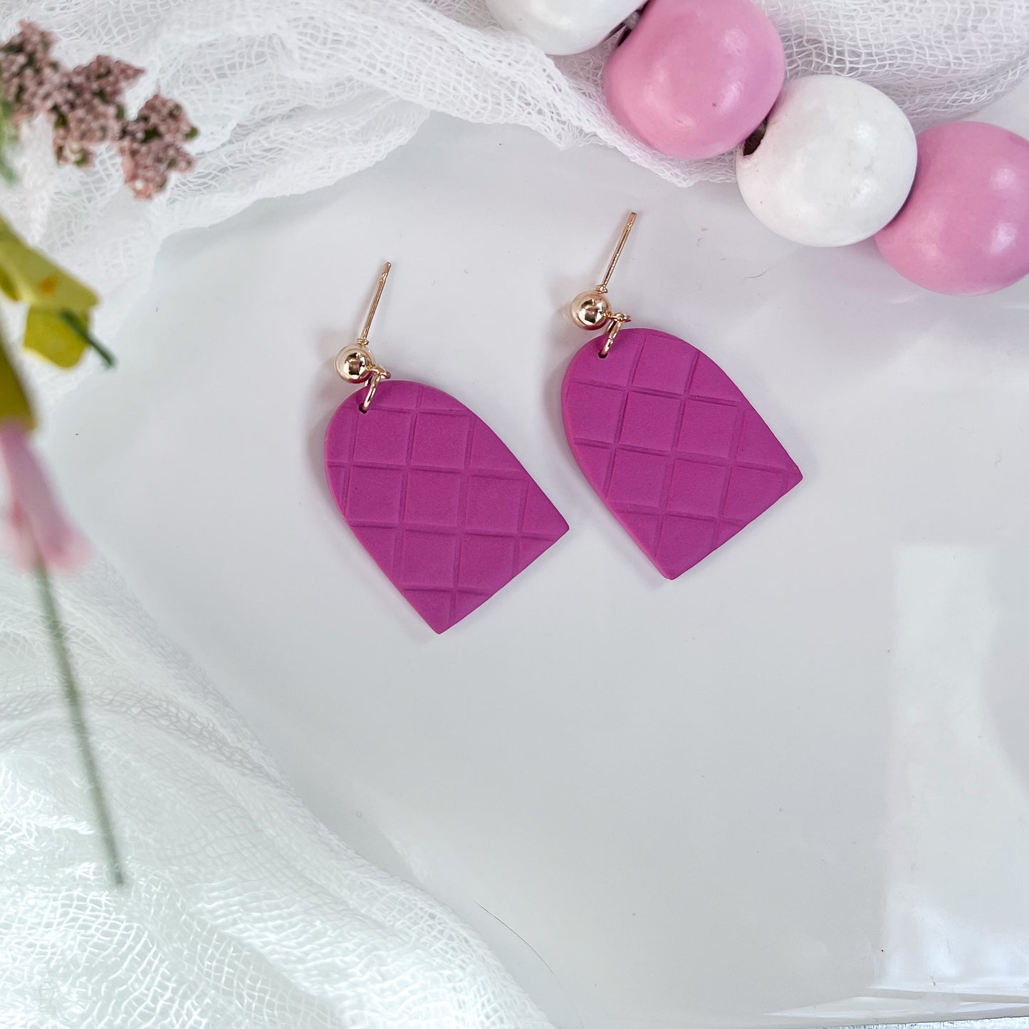 Evelyn quilted dangle earrings in dark pink